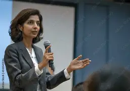 Woman speaking confidently during a wellness empowerment session.